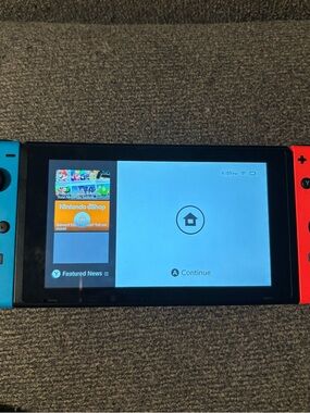 Nintendo Switch with Neon Blue and Neon Red Joy‑Con